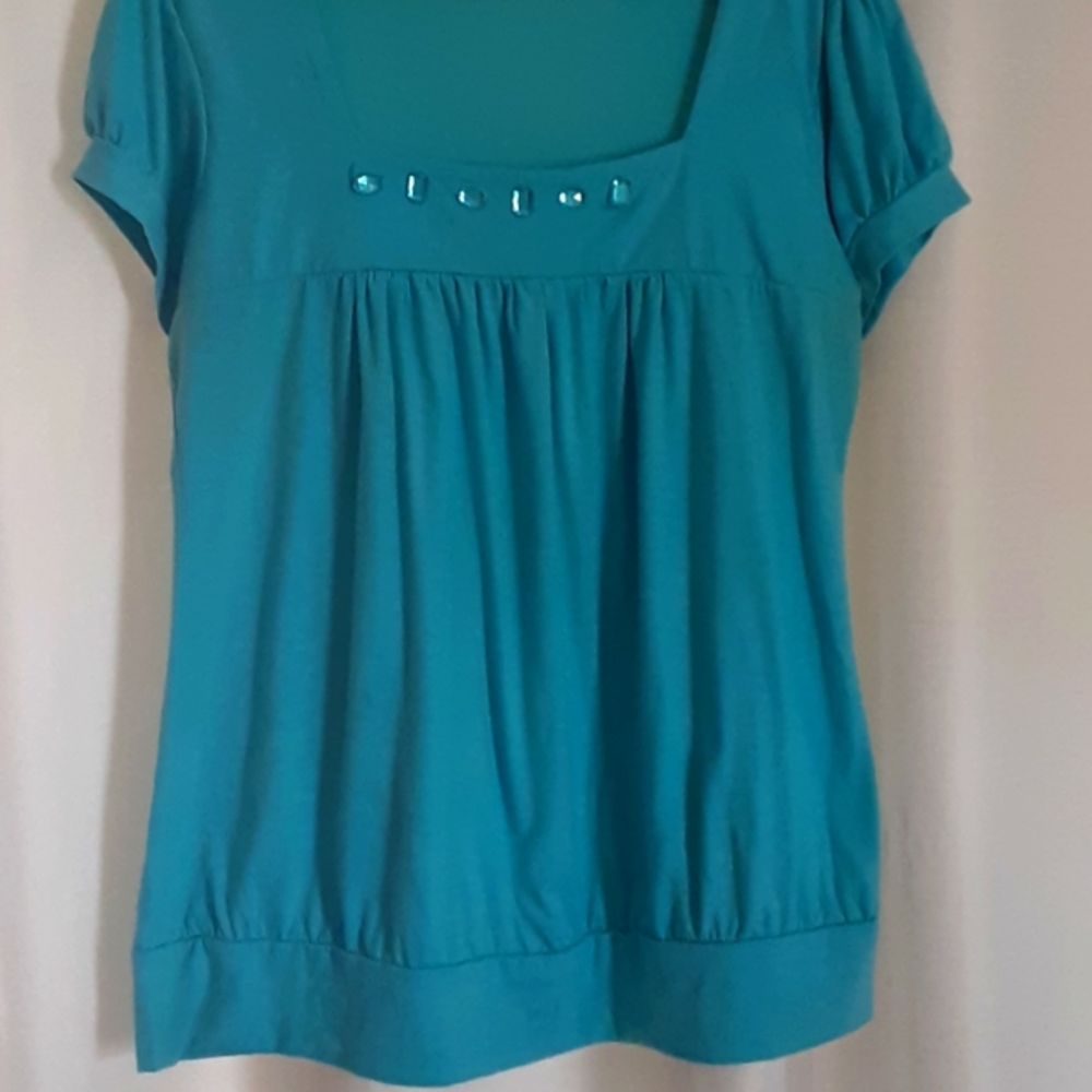 Womans top light blue, square neckline with blue stones short sleeve loose fit